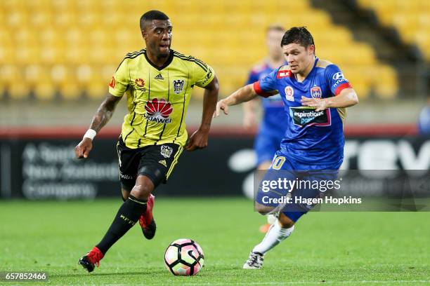 Roly Bonevacia of the Phoenix avoids the defense of Wayne Brown of the Jets during the round 24 A-League match between Wellington Phoenix and...