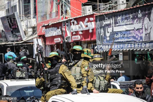 Masked gunmen from the Qassam brigade, the militia wing of Hamas, attend the funeral of Mazen Faqha in Gaza City, Saturday, March 2017. The former...