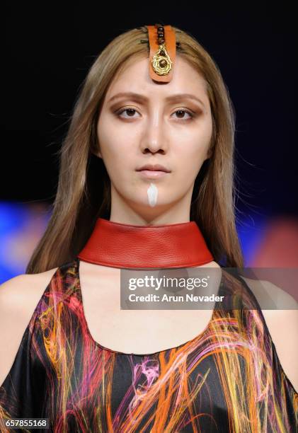 Model walks the runway wearing Pierrot by Emma Viedma at Vancouver Fashion Week Fall/Winter 2017 at Chinese Cultural Centre of Greater Vancouver on...