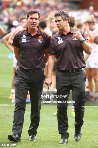 Giants head coach Leon Cameron and and General Manager of Football Operations Wayne Campbell walk off the ground after the round one AFL match...