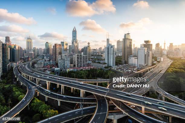 road junction in shanghai cbd at sunrise - shanghai stockfoto's en -beelden