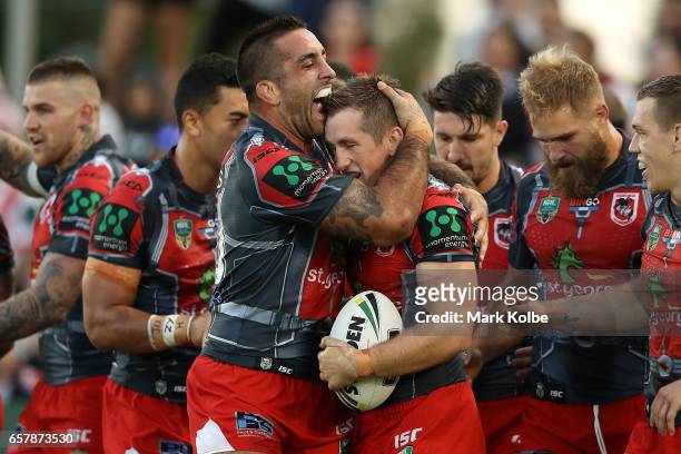Paul Vaughan of the Dragons congratulates Josh McCrone of the Dragons as he celebrates scoring a try during the round four NRL match between the St...