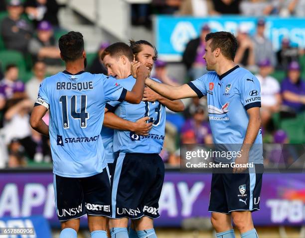 Team mates celebrate with Brandon O'Neill of Sydney FC after scoring during the round 24 A-League match between Perth Glory and Sydney FC at nib...