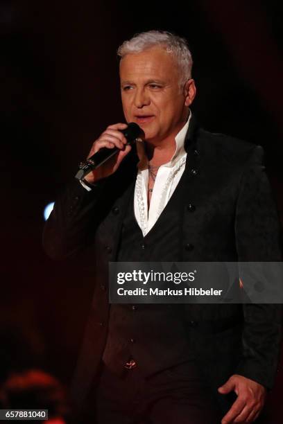 German singer Nino de Angelo performs during the show 'Schlagercountdown - Das grosse Premierenfest' at EWE Arena on March 25, 2017 in Oldenburg,...