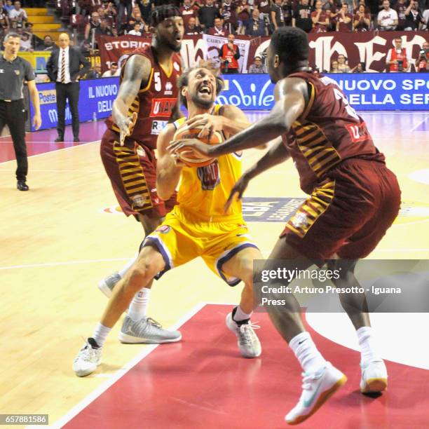 Giuseppe Poeta of Fiat competes with Julyan Stone and Melvin Ejim of Umana during the LegaBasket LBA of Serie A1 match between Reyer Umana Venezia...