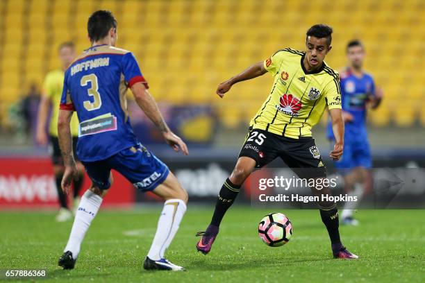 Sarpreet Singh of the Phoenix attempts to evade Jason Hoffman of the Jets during the round 24 A-League match between Wellington Phoenix and Newcastle...