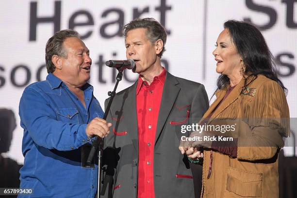 Randy Travis and Mary Travis perform onstage during BeautyKind Unites: Concert for Causes at AT&T Stadium on March 25, 2017 in Arlington, Texas.