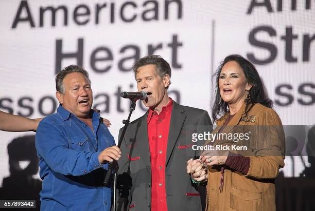 Randy Travis and Mary Travis perform onstage during BeautyKind Unites: Concert for Causes at AT&T Stadium on March 25, 2017 in Arlington, Texas.