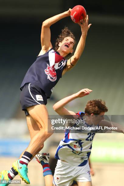 Max King of the Sandringham Dragons competes for the ball over Ethan Phillips of the Oakley Chargers during the 2017 TAC round 01 match between the...