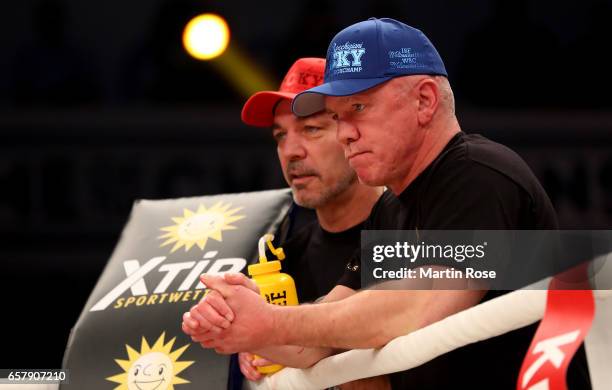 The coaches of Vincenzo Gualtieri of Germany, Ralph Rocchigiani and Graciano Rocchigiane look on during the middleweight fight at MBS Arena on March...