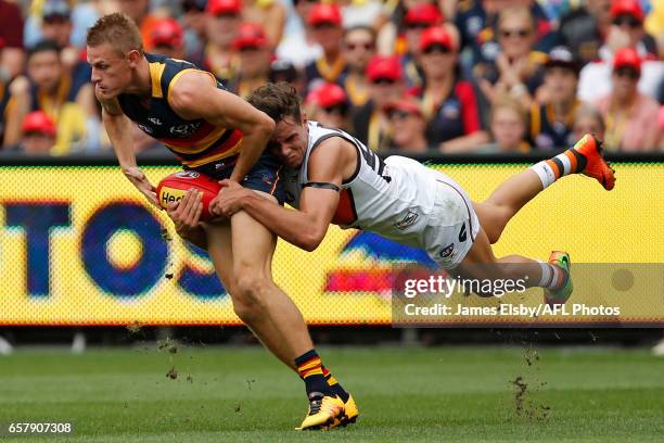 David Mackay of the Crows is tackled by Toby Greene of the Giants during the 2017 AFL round 01 match between the Adelaide Crows and the GWS Giants at...