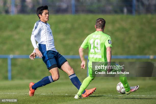 Koki Machida of Japan and Nico Klotz of Duisburg in action during a Friendly Match between MSV Duisburg and the U20 Japan on March 26, 2017 in...