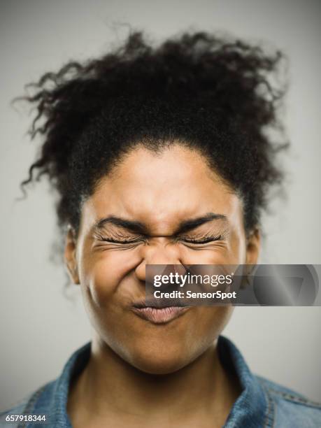 close-up portrait of a stressed real young afro american woman - shock stock pictures, royalty-free photos & images