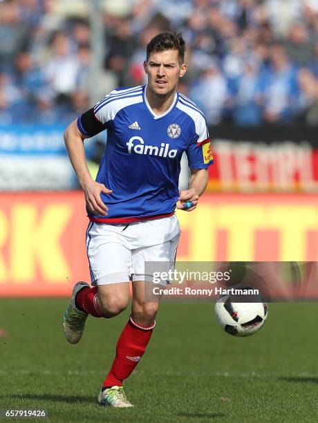 Tim Siedschlag of Kiel runs with the ball during the Third League match between Holstein Kiel and 1. FC Magdeburg at Holstein-Stadion on March 25,...