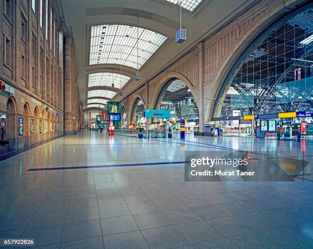 inside of leipzig main train station - floor perspective stock-fotos und bilder