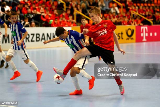 Raphael Polczyk of Brakel challenges Emincan Tekin of Hertha BSC Berlin during the thrid place match Junior C between Hertha BSC Berlin and SpVg...