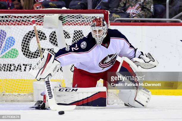 Sergei Bobrovsky of the Columbus Blue Jackets makes a save against the Washington Capitals in the first period during an NHL game at Verizon Center...