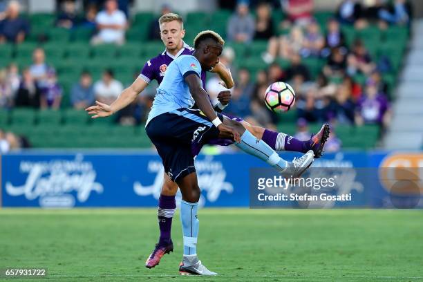 Bernie Ibini of Sydney FC and Joseph Mills of the Glory contest the ball during the round 24 A-League match between Perth Glory and Sydney FC at nib...