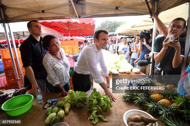 French presidential election candidate for the En Marche! movement Emmanuel Macron , flanked by member of the National Assembly Monique Orphe ,...