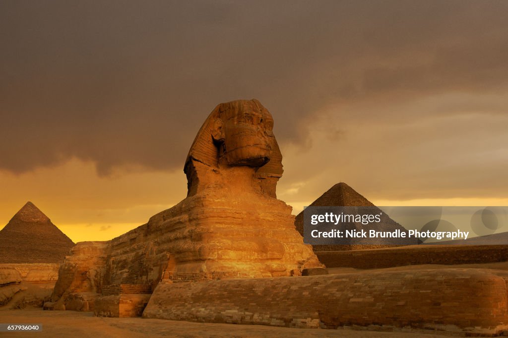 Sunset at the Sphinx and Pyramid complex Giza, Egypt.