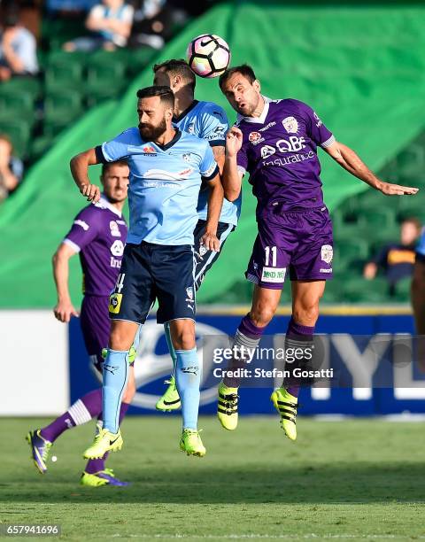 Alex Brosque of Sydney FC and Richard Garcia of the Glory contest a header during the round 24 A-League match between Perth Glory and Sydney FC at...