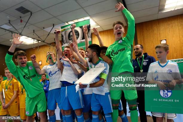 The team of Schalke lifts the winning trophy of the B Juniors German Indoor Football Championship at Sporthalle West on March 26, 2017 in Gevelsberg,...