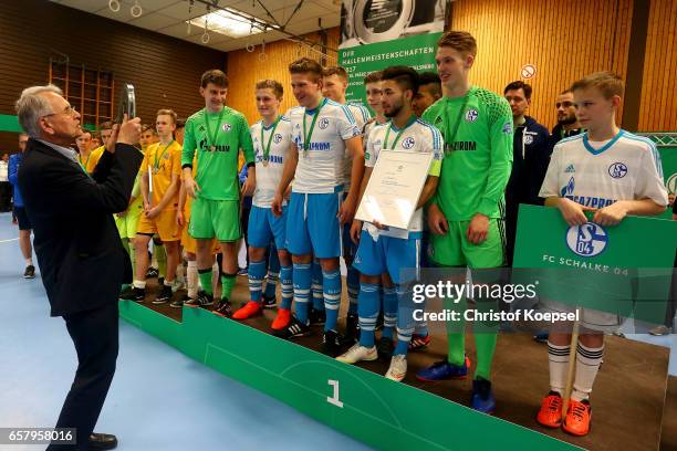 Doktor Hans-Dieter Drewitz, vice president of German Football Association hands out the winning trophy to the team of FC Schalke 04 of the B Juniors...