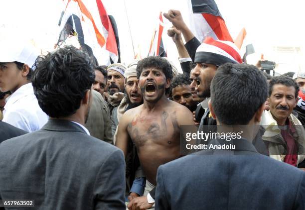 Houthis and supporters of ousted leader Ali Abdullah Saleh gather to protest the Saudi-led operations during a rally on the second anniversary of the...