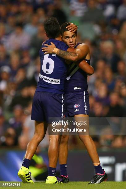 Danyle Pearce and Michael Walters of the Dockers celebrate a goal during the round one AFL match between the Fremantle Dockers and the Geelong Cats...