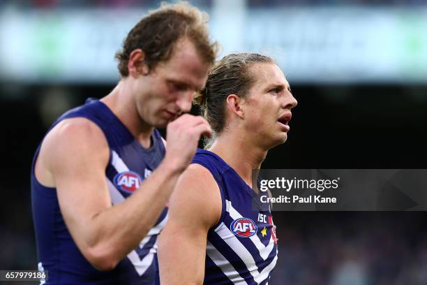 David Mundy and Nathan Fyfe of the Dockers walk from the field at the half time break during the round one AFL match between the Fremantle Dockers...