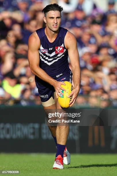 Shane Kersten of the Dockers looks to pass the ball during the round one AFL match between the Fremantle Dockers and the Geelong Cats at Domain...