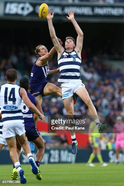 Nathan Fyfe of the Dockers and Mark Blicavs of the Cats contest a mark during the round one AFL match between the Fremantle Dockers and the Geelong...