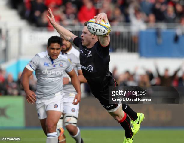 Chris Ashton of Saracens dives over for his second try during the Aviva Premiership match between Saracens and Bath at Allianz Park on March 26, 2017...