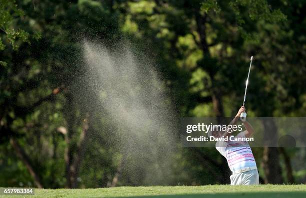 Hideto Tanihara of Japan plays his seocnd shot on teh par 5, sixth hole in his match against Dustin Johnson during the semi-final of the 2017 Dell...