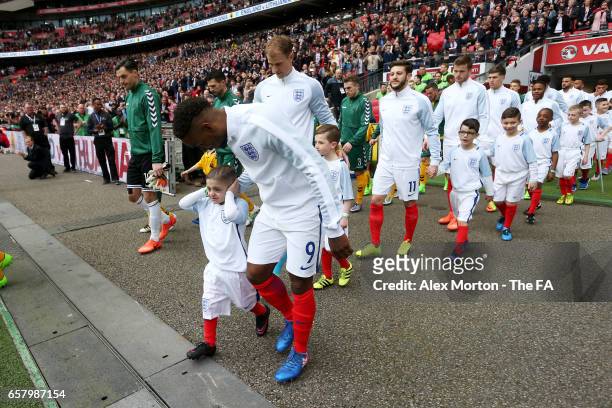 England mascot Bradley Lowery is walked out onto the pitch by Jermain Defoe of England during the FIFA 2018 World Cup Qualifier between England and...