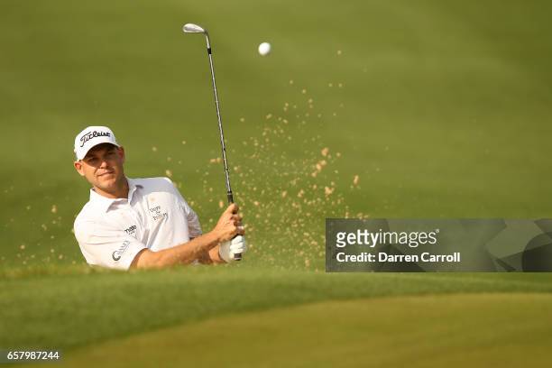 Bill Haas plays a shot out of a bunker on the 3rd hole of his match during the semifinals of the World Golf Championships-Dell Technologies Match...