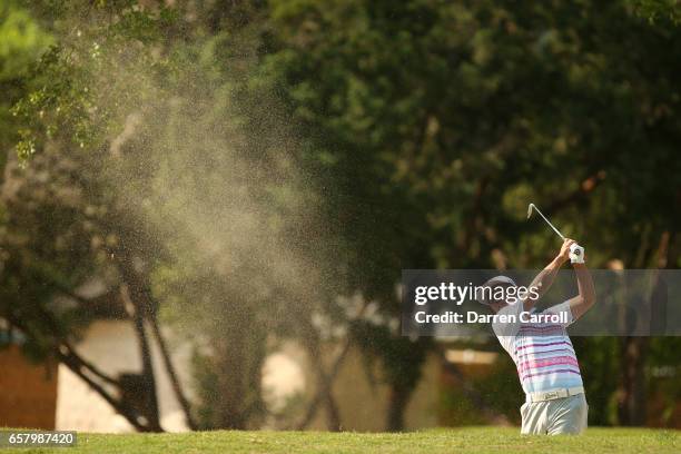 Hideto Tanihara of Japan plays a shot out of a bunker on the 6th hole of his match during the semifinals of the World Golf Championships-Dell...