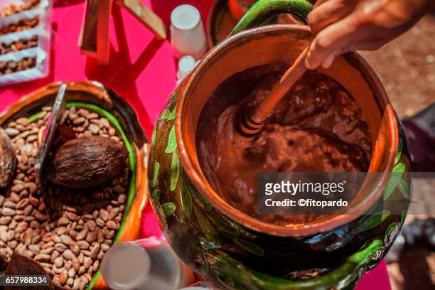 cacao fruit, cacao seed and chocolate being prepared - theobroma foto e immagini stock