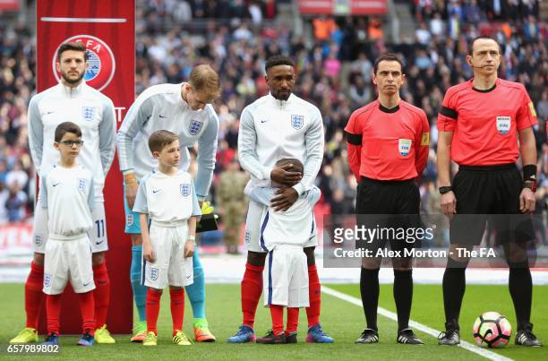 England mascot Bradley Lowery hugs Jermain Defoe of England prior to the FIFA 2018 World Cup Qualifier between England and Lithuania at Wembley...