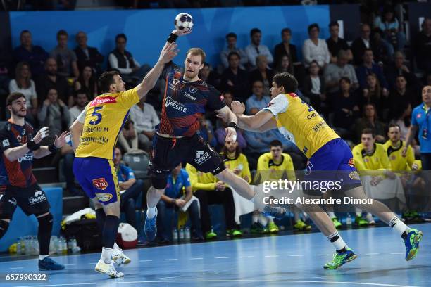 Jonas Truchanovicius of Montpellier and Michal Jurecki of Kielce during the Champions League match between Montpellier and Kielce on March 26, 2017...