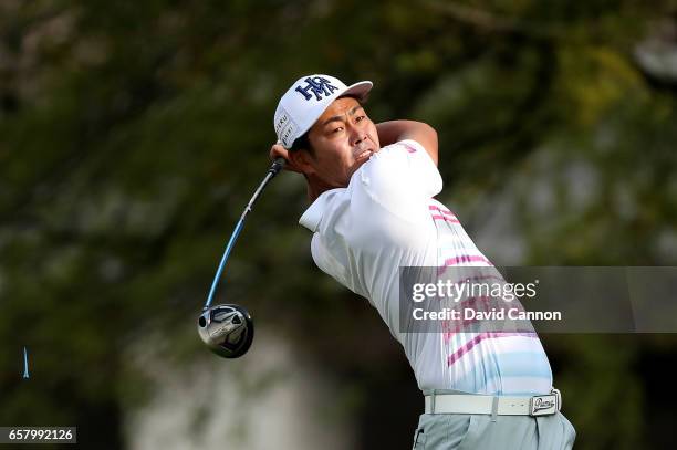 Hideto Tanihara of Japan plays his tee shot on the par 4, first hole in his match against Dustin Johnson during the semi-final of the 2017 Dell Match...