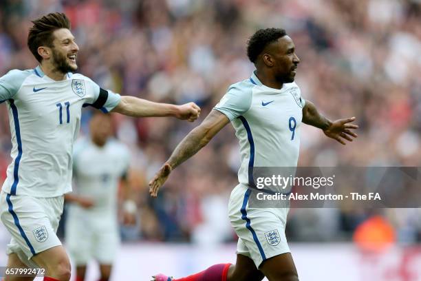 Jermaine Defoe of England celebrates with Adam Lallana after scoring his sides first goal during the FIFA 2018 World Cup Qualifier between England...