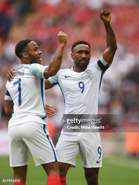 Jermaine Defoe of England celebrates with Raheem Sterling after scoring his sides first goal during the FIFA 2018 World Cup Qualifier between England...