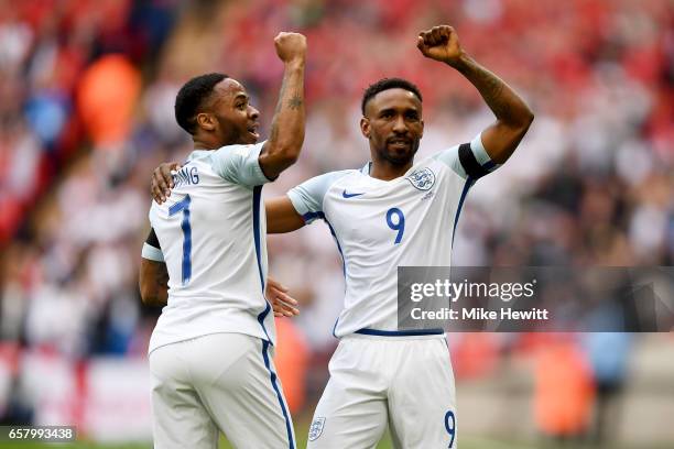 Jermaine Defoe of England celebrates with Raheem Sterling after scoring his sides first goal during the FIFA 2018 World Cup Qualifier between England...