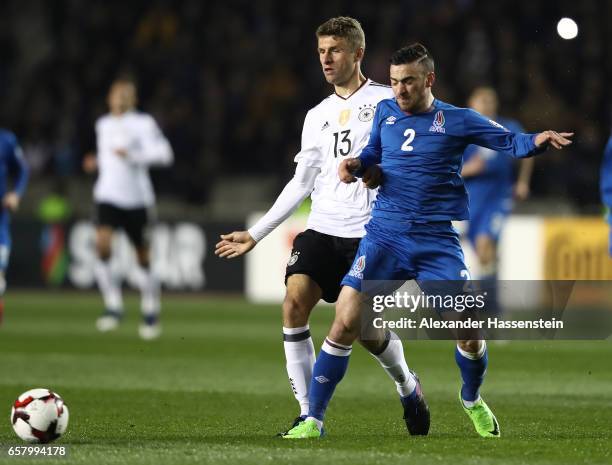 Thomas Mueller of Germany is challenged by Gara Garayev of Azerbaijan during the FIFA 2018 World Cup Qualifing Group C between Azerbaijan and Germany...