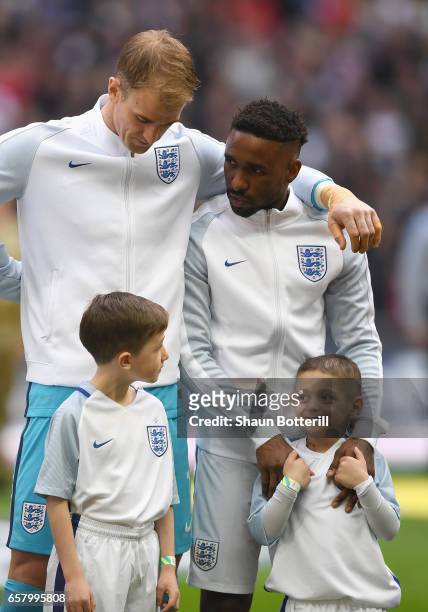 Jermaine Defoe of England and England mascot Bradley Lowery line up alongside Joe Hart prior to the FIFA 2018 World Cup Qualifier between England and...