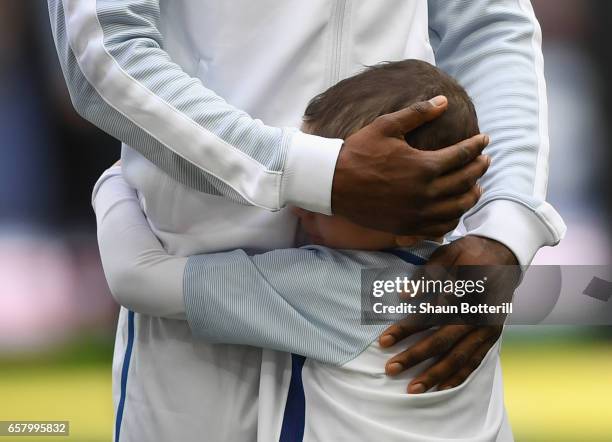 England mascot Bradley Lowery hugs Jermain Defoe of England prior to the FIFA 2018 World Cup Qualifier between England and Lithuania at Wembley...