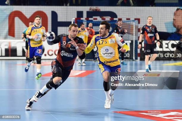 Valentin Porte of Montpellier and Manuel Strlek of Kielce during the Champions League match between Montpellier and Kielce on March 26, 2017 in...