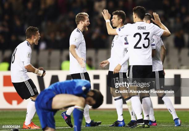 Mario Gomez celebrates scoring the second goal with Andre Schuerrle during the FIFA 2018 World Cup Qualifiying group C match between Azerbaijan and...