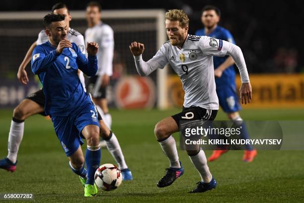 Azerbaijan's Gara Garayev and Germany's Andre Schuerrle vie for the ball during the FIFA World Cup 2018 qualification football match between...